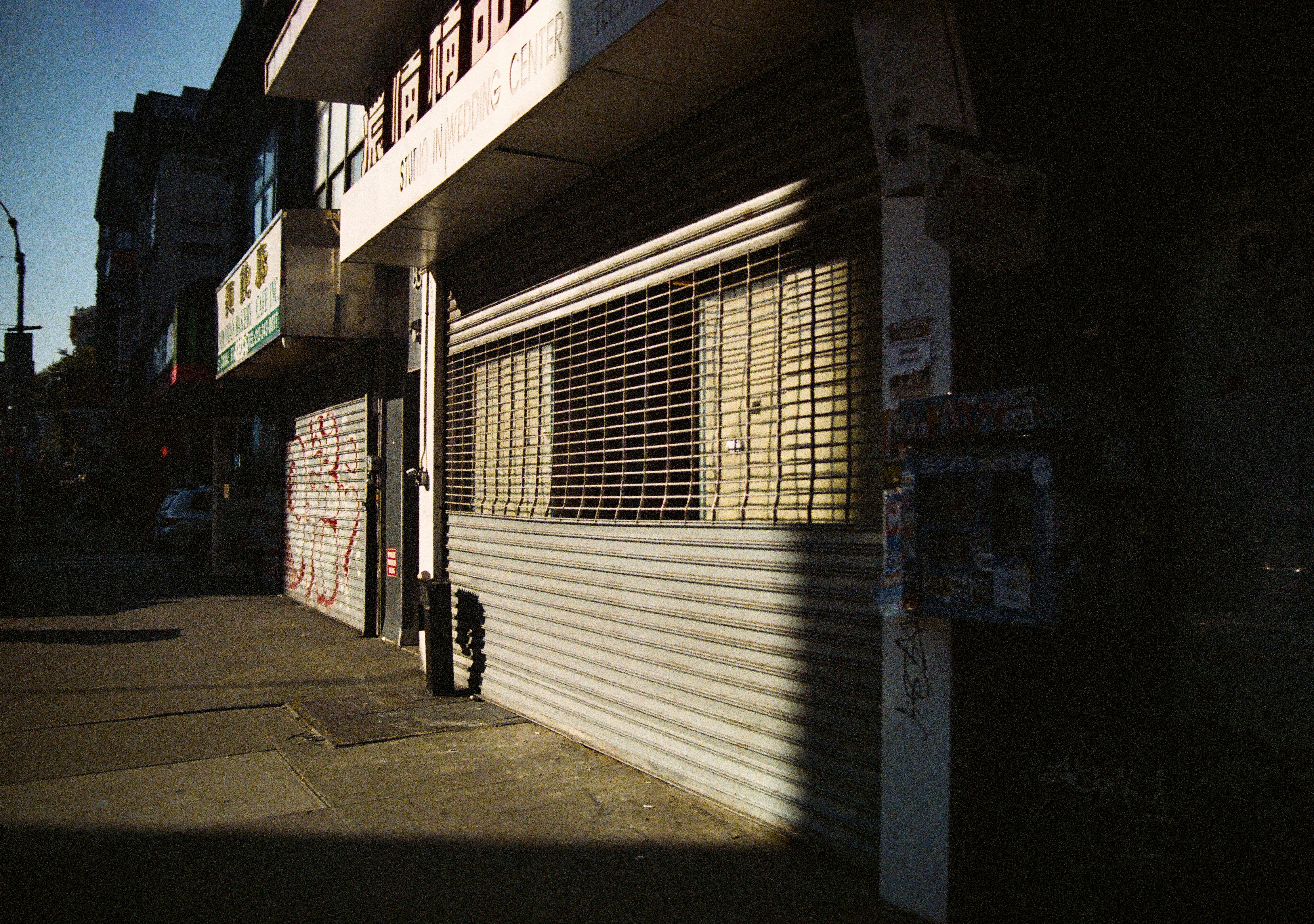 Photo of a shuttered storefront on a city street