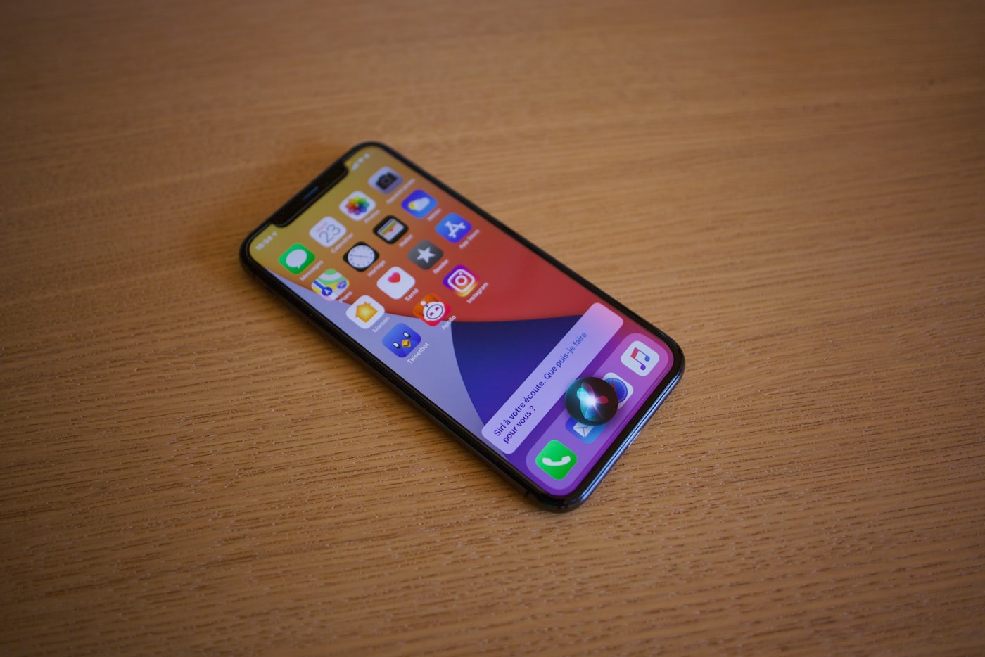 An iPhone displaying the Siri interface; the photograph is contextual and does not show Siri AI in iOS 27
