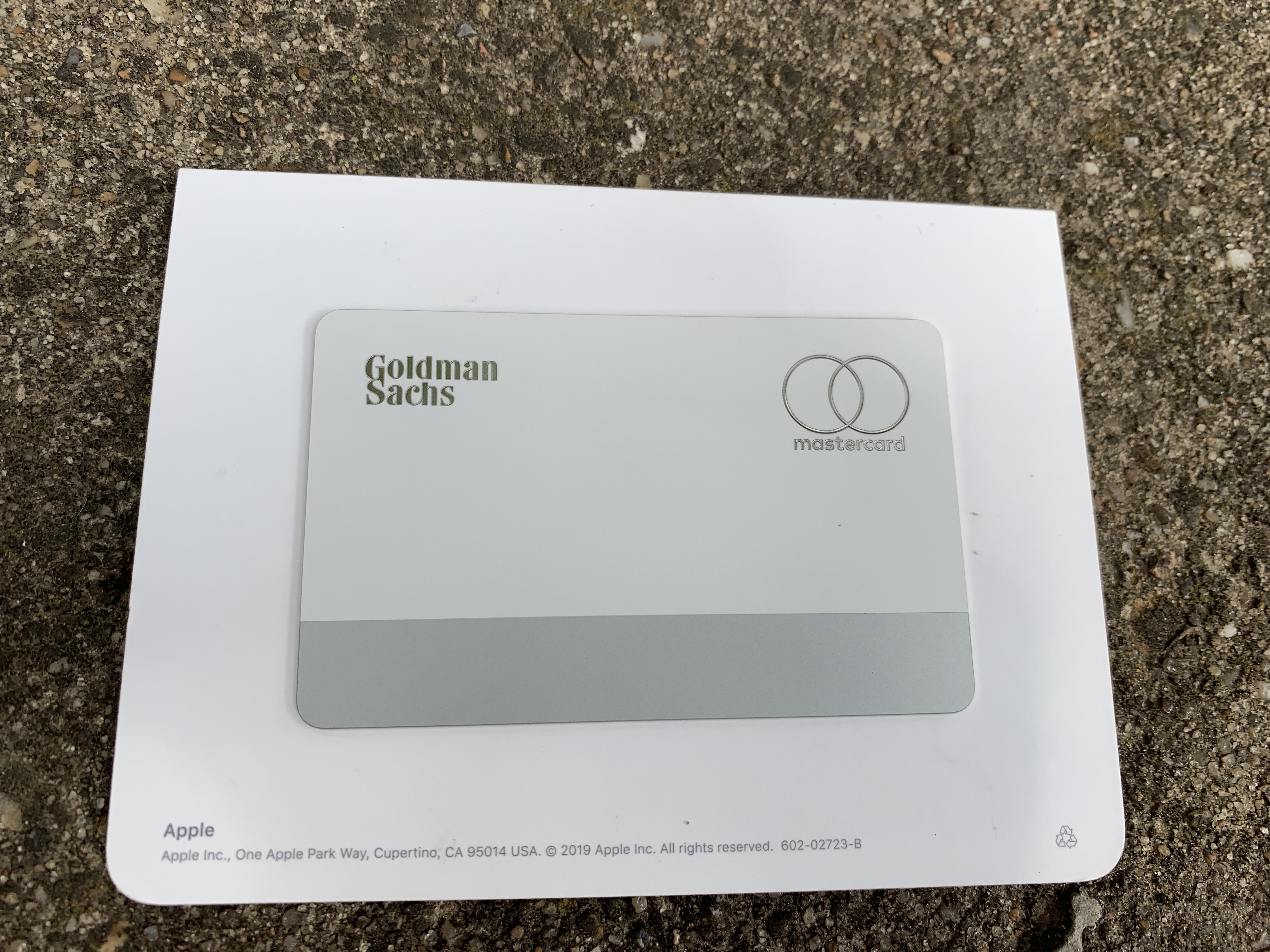 An Apple Card issued by Goldman Sachs on its original packaging